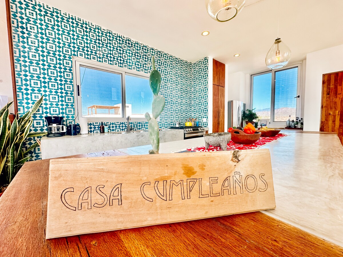 Kitchen island and the Casa Cumpleaños sign