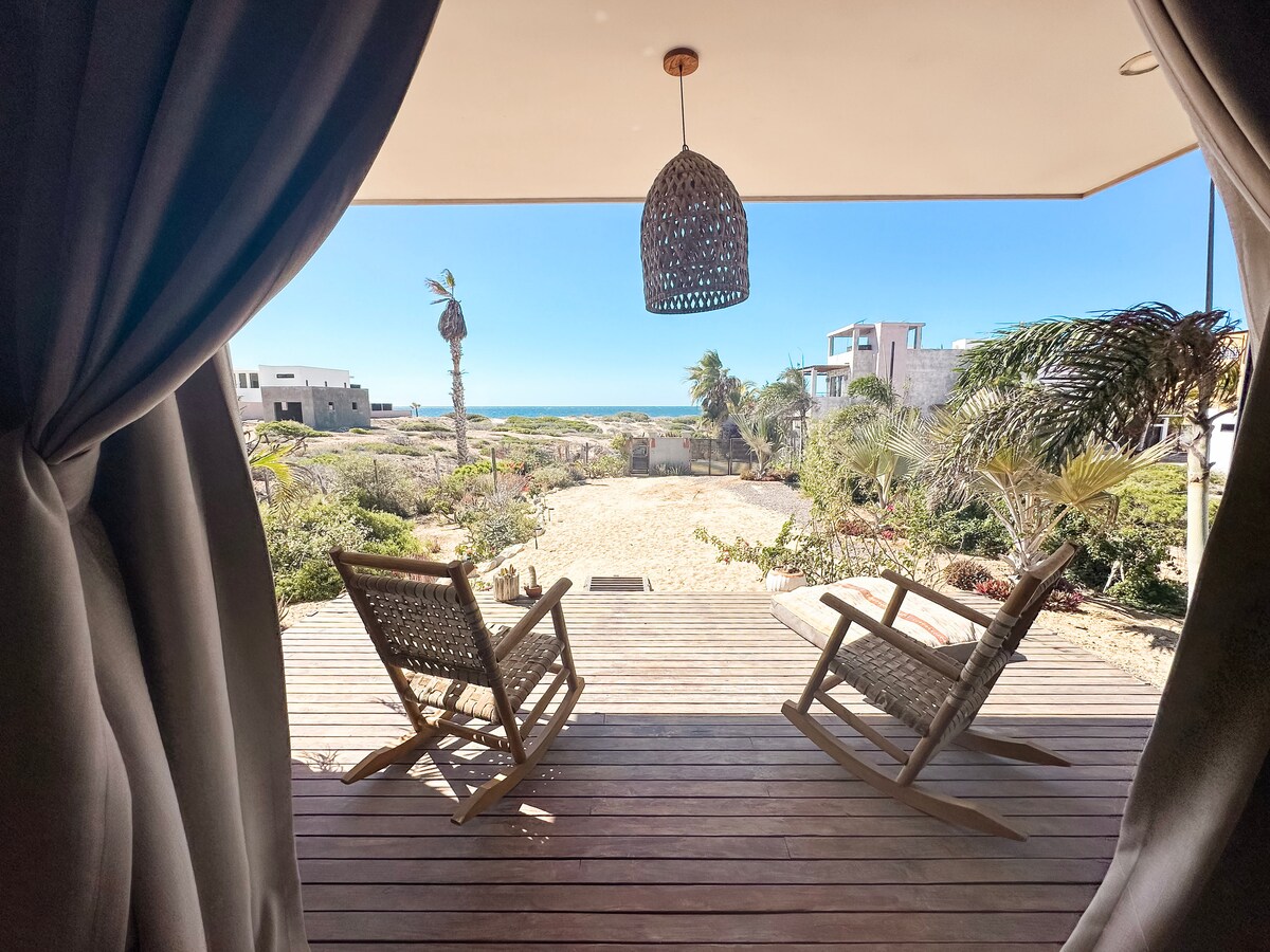 Rocking chairs on the primary bedroom deck facing the ocean