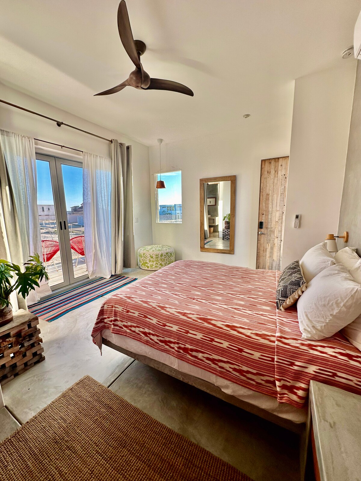 Second bedroom with a queen bed and south-facing balcony